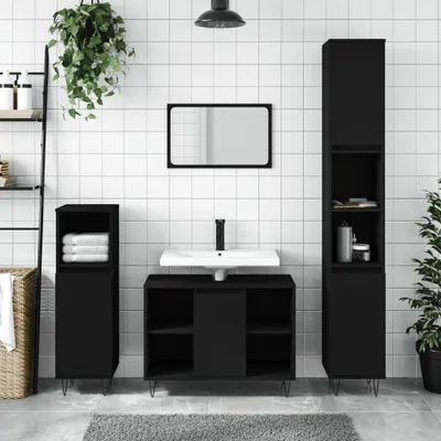 A modern black bathroom vanity set with a sink, mirror, and storage cabinets against a tiled wall.