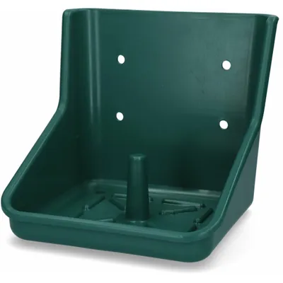 A green plastic holder for a lick stone, designed to be mounted on a wall.