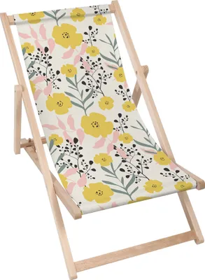 A close-up, angled view of a folding deck chair with a floral pattern.