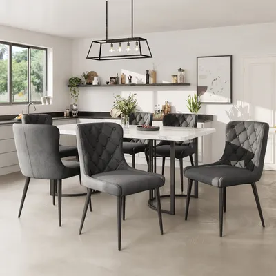 A dining room set with a table and chairs in a modern kitchen setting.