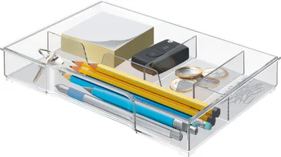A clear, well-lit studio shot of a transparent plastic desk organizer filled with office supplies.