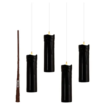 A wand and four black LED candles are displayed against a white background.