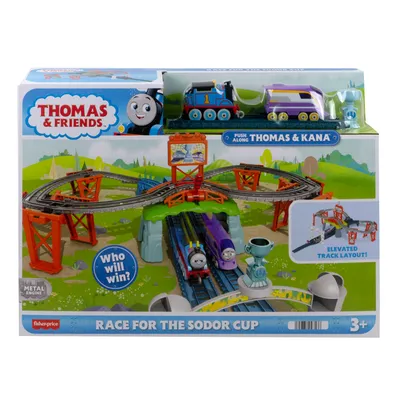A product box for a Thomas & Friends toy train set, featuring a race track layout with Thomas and Kana trains.