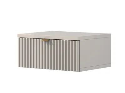 A floating bedside table with a ribbed drawer front and a gold handle, shown against a white background.