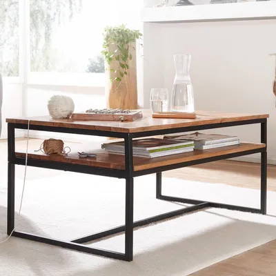 A coffee table in a living room setting with decorative items.