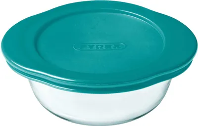 A clear studio shot of a glass bowl with a teal lid.