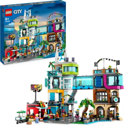 Produktbild von LEGO 60380 City Stadtzentrum Set, Modellbausatz, Spielzeug mit Spielzeugläden wie Friseur, Tierarzt, Hotel und Dachdisco mit Minifiguren und Straßenplatten, Geschenk zum Geburtstag für Kinder