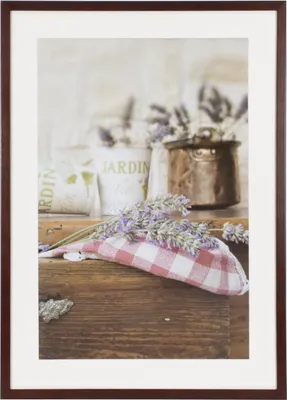 A framed picture of lavender and rustic decor.