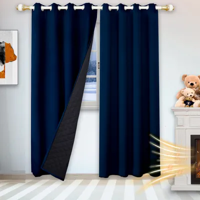 A room with a window, fireplace, and teddy bears, showcasing navy blue thermal curtains.