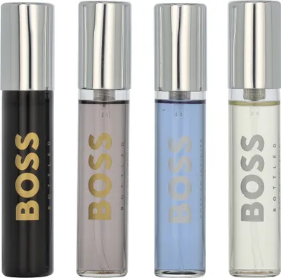 Four miniature bottles of Hugo Boss fragrance are displayed side-by-side against a white background.