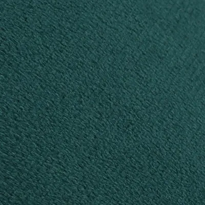 A close-up view of a dark teal velvet fabric.