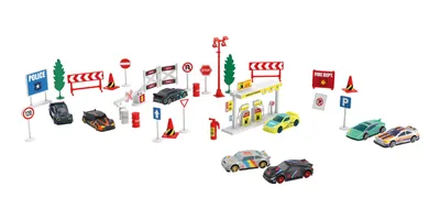 A collection of toy cars, traffic signs, and a gas station.