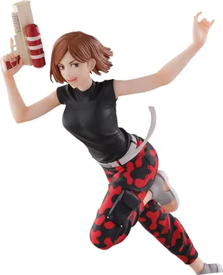A dynamic action pose of a female anime figurine holding a water gun.