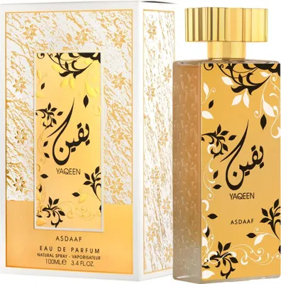 A perfume bottle and its packaging are displayed against a white background.