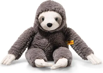 A plush sloth toy is sitting on a white background.