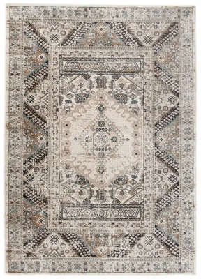 A flat lay of a rectangular rug with a classic, distressed design.