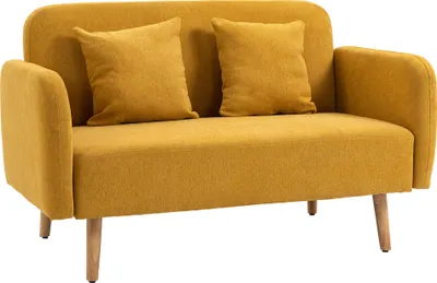 A yellow loveseat with two yellow throw pillows on a white background.