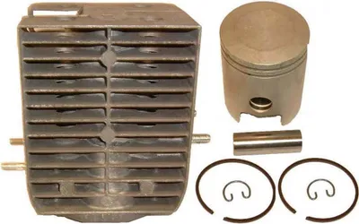 A set of engine parts, including a cylinder and piston, laid out on a white background.
