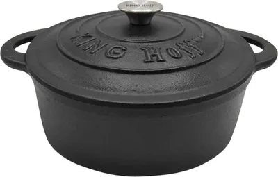 A black cast iron pot with a lid.