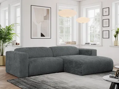 A modern living room with a dark gray corduroy sectional sofa.