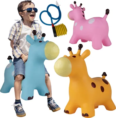 A child is riding a blue inflatable giraffe toy, with pink and orange giraffes and a pump in the background.