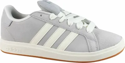 A side view of a single Adidas sneaker.