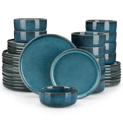 A collection of blue ceramic dishes, including bowls and plates, stacked neatly.