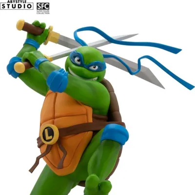 A close-up, dynamic shot of a Teenage Mutant Ninja Turtle action figure, Leonardo, holding his katanas.