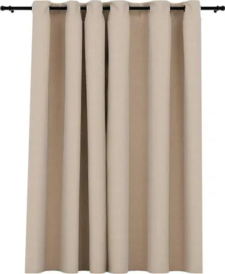 A plain background shot of beige curtains hanging from a black curtain rod.