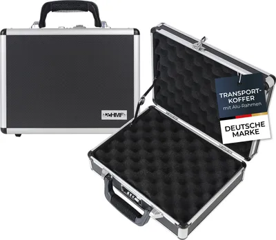 Two HMF aluminum transport cases are shown, one closed and one open, against a white background. The open case reveals foam padding inside. Promotional tags are attached to the open case.