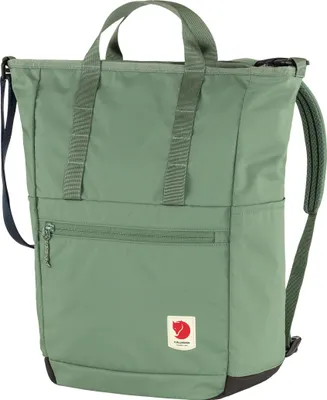 A green backpack is shown against a white background.