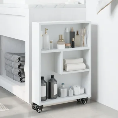 A white rolling storage cart filled with bathroom items next to a vanity.