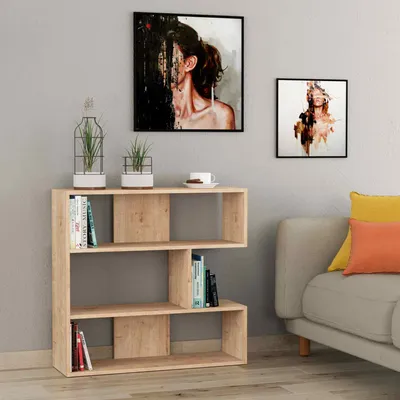 A modern wooden bookshelf with books and decorative items in a room setting.