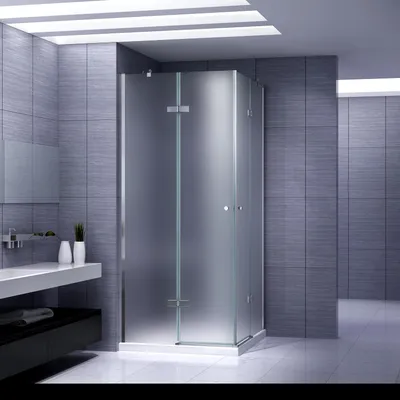 A modern bathroom with a frosted glass shower enclosure.