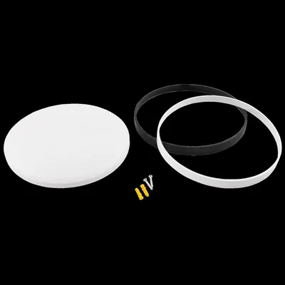A white circular light fixture with two rings (one black, one white) and mounting hardware, laid out on a black background.