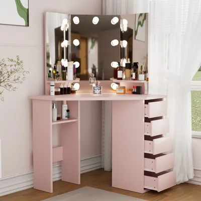 A pink vanity table with a tri-fold mirror and LED lights, set up in a room with sheer curtains.