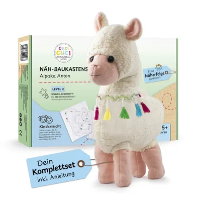A sewing kit for making an alpaca plush toy, with the finished toy prominently displayed next to its packaging.