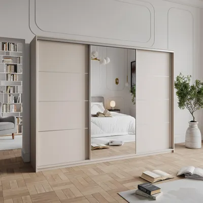 A bedroom scene with a large wardrobe with mirrored doors, a bed, and a bookshelf.