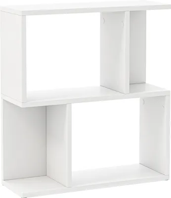 A white, modern, modular bookshelf with four open compartments, arranged in a staggered, two-tier design.