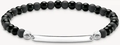 A bracelet with black beads and a silver bar.