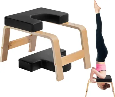 A yoga headstand bench and a person using it for a headstand.