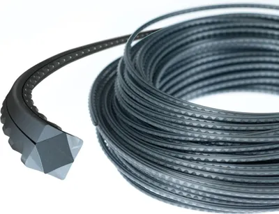 A coil of metal wire with a black plastic handle.