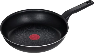 A black frying pan with a red indicator in the center and a silver rim, set against a white background.