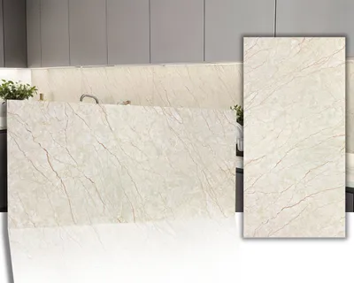 A kitchen countertop and backsplash with a marble-like pattern, with a sample tile shown in the foreground.