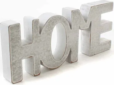 A white wooden decorative sign spelling out the word "HOME" on a white background.