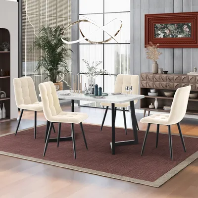A dining room set with a marble-top table and four beige chairs, set on a burgundy rug.