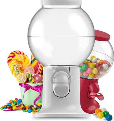 A white gumball machine is shown in the foreground, with a red gumball machine in the background. Various candies and lollipops are arranged around the machines.