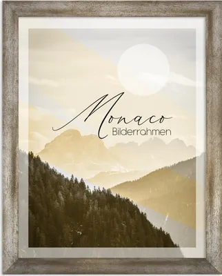 A framed picture of a mountain landscape with text overlay.