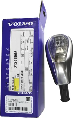 A Volvo gear shift knob and its packaging are displayed on a white background.