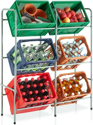 A metal rack filled with various crates containing items like pottery, fruits, and bottles of beverages.